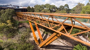 Deakin University Burwood pedestrian bridge uses BlueScope REDCOR® weathering steel to deliver a practical, paint-free structure requiring minimal maintenance compared with conventional structural steel